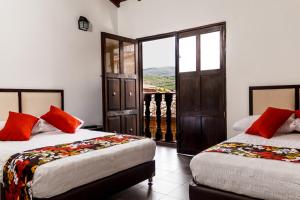 Postel nebo postele na pokoji v ubytování Hotel Casa Suite Curiti