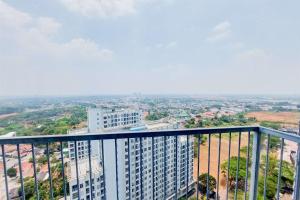 a view of a city from the top of a building at Homey and Modern 2BR at Casa de Parco Apartment By Travelio in Tangerang