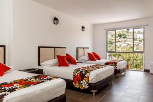 Postel nebo postele na pokoji v ubytování Hotel Casa Suite Curiti + 37 fotografií
