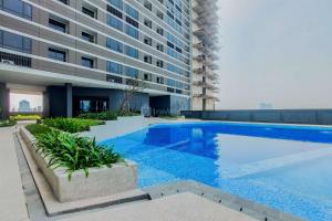 Πισίνα στο ή κοντά στο Modern Look Studio Room Collins Boulevard Apartment By Travelio