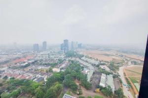 an aerial view of a city with tall buildings at Comfort Living and Homey 1BR The Smith Alam Sutera Apartment By Travelio in Tangerang