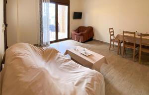 A bed or beds in a room at Nice Apartment In Nafpaktos With Wifi