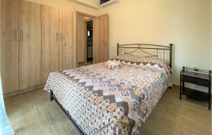 A bed or beds in a room at Nice Apartment In Nafpaktos With Wifi