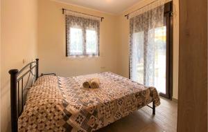A bed or beds in a room at Nice Apartment In Nafpaktos With Wifi
