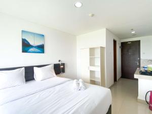 Restful and Comfy Studio Enviro Apartment By Travelio客房内的一张或多张床位