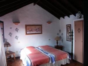 a bedroom with a bed in a room at Villa mit Pool und herrlichem Meerblick in Playa Blanca +12 photos