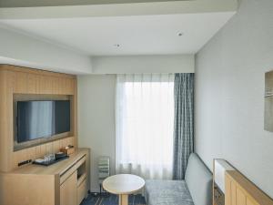 TV a/nebo společenská místnost v ubytování Hotel Traveltine Kyoto Kiyamachi