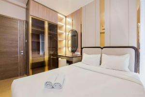 Postel nebo postele na pokoji v ubytování Scenic and Restful 2BR Sky House BSD Apartment By Travelio