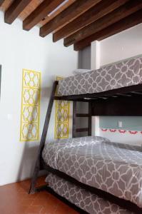 a bedroom with a bunk bed in a room at Estudio Centro histórico ciudad de morelia in Morelia