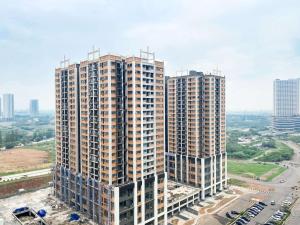 an overhead view of a tall building in a city at Best Deal and Cozy 3BR Meikarta Apartment By Travelio in Cikarang