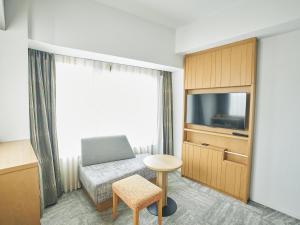 TV a/nebo společenská místnost v ubytování Hotel Traveltine Kyoto Kiyamachi