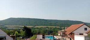 a view of a house with a mountain in the background at Salasuka Views in Dryanovo