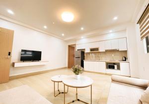 a living room with a couch and a table at D&H Hotel and Apartment in Hai Phong