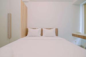 Ένα ή περισσότερα κρεβάτια σε δωμάτιο στο Comfy and Best Deal Studio at Citra Living Apartment By Travelio +16 φωτογραφίες