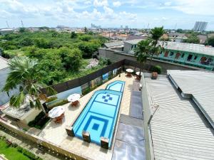 an overhead view of a swimming pool on a building at Comfort 2BR at 6th Floor Metropark Condominium Jababeka Apartment By Travelio in Cikarang