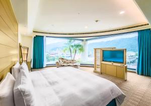 承万尊爵渡假酒店客房内的一张或多张床位