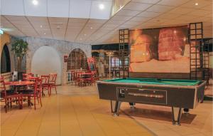 a pool table in the middle of a restaurant at 3 Bedroom Awesome Home In Gramsbergen in Gramsbergen +13 photos