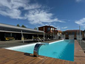 a large swimming pool in front of a building at Black Sea Resort in Primorskoye