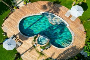 an overhead view of a swimming pool with umbrellas at Kaya Villas Exclusive in Kayakoy