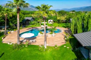 an aerial view of a backyard with a swimming pool at Kaya Villas Exclusive in Kayakoy