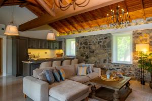 a living room with a couch and a table at Kaya Villas Exclusive in Kayakoy