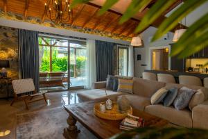 a living room with a couch and a table at Kaya Villas Exclusive in Kayakoy