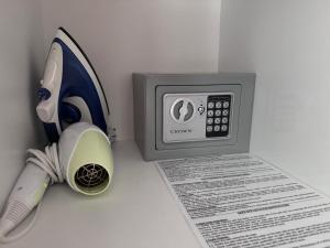 a phone and a pen next to a piece of paper at Apartment Premier Fort Beach hotel F1 420 in Sveti Vlas