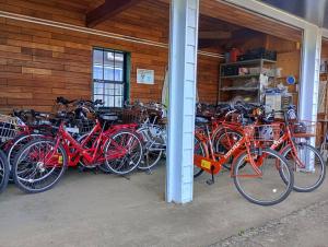 a bunch of bikes parked in a garage at Sakurah in Sakura