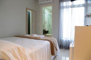 Postel nebo postele na pokoji v ubytování Hotel São Mateus