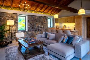 a living room with a couch and a table at Kaya Villas Exclusive in Kayakoy