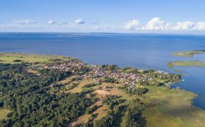 an aerial view of an island in the water at Barrierefreies Ferienhaus in Altwarp mit Sauna, Kamin und Wasserblick in Altwarp