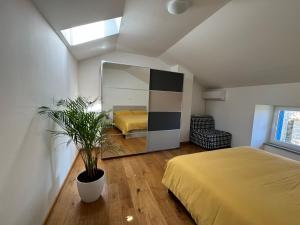 a bedroom with a bed and a large mirror at Santomas apartments in Šmarje