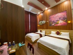 Postel nebo postele na pokoji v ubytování Phi Hùng Hotel