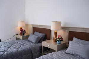 Postel nebo postele na pokoji v ubytování Sophia Apartment - Sophia Center Phu Cuong