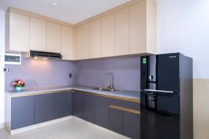 Kuchyň nebo kuchyňský kout v ubytování Sophia Apartment - Sophia Center Phu Cuong