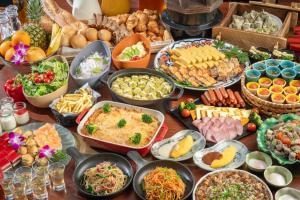 a table topped with lots of different types of food at Hotel Trad Hakata in Fukuoka