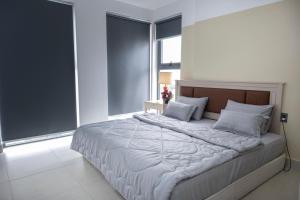 Postel nebo postele na pokoji v ubytování Sophia Apartment - Sophia Center Phu Cuong
