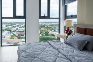 Postel nebo postele na pokoji v ubytování Sophia Apartment - Sophia Center Phu Cuong