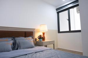 Postel nebo postele na pokoji v ubytování Sophia Apartment - Sophia Center Phu Cuong