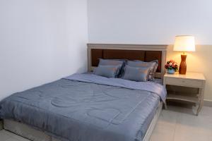 Postel nebo postele na pokoji v ubytování Sophia Apartment - Sophia Center Phu Cuong