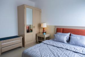 Postel nebo postele na pokoji v ubytování Sophia Apartment - Sophia Center Phu Cuong