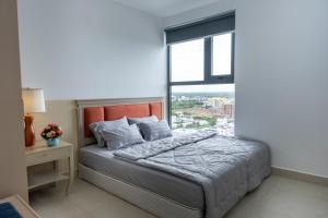 Postel nebo postele na pokoji v ubytování Sophia Apartment - Sophia Center Phu Cuong