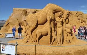 a sand sculpture of a woman and a giraffe at Holiday Home Ringkobing Iii in Søndervig