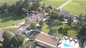 an aerial view of a large mansion with a building at Ch&acirc;teau de Briante in Saint-Lager