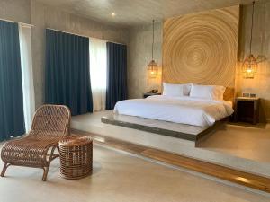 Rúm í herbergi á Cebu R Resort Tabuelan