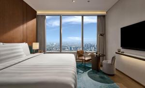 Pan Pacific Jakarta客房内的一张或多张床位