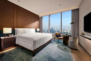 Pan Pacific Jakarta客房内的一张或多张床位