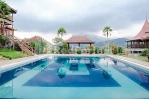 Bazén v ubytování Grand Pujon View Hotel And Resort Mitra RedDoorz nebo v jeho okolí