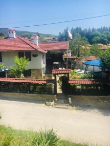 a house with a fence in front of it at Dyadovata Kashta in Elena