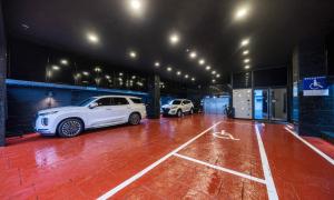 a garage with two cars parked in it at Anyang ILLOWA Hotel in Anyang